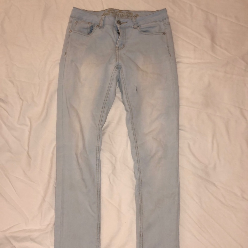 Light wash wax skinny jeans